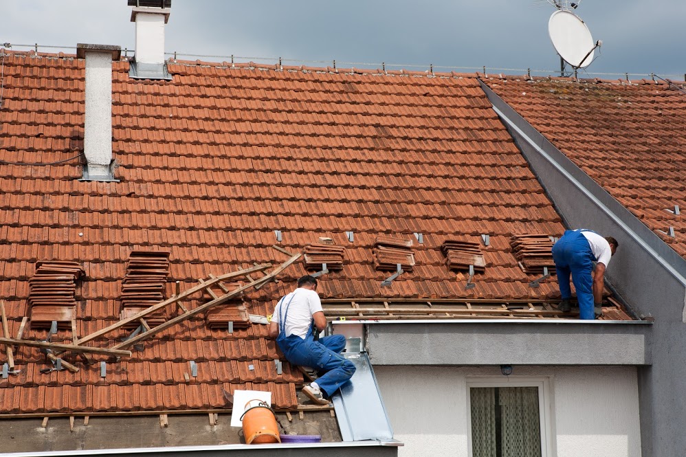 roofers working on a roof restoration